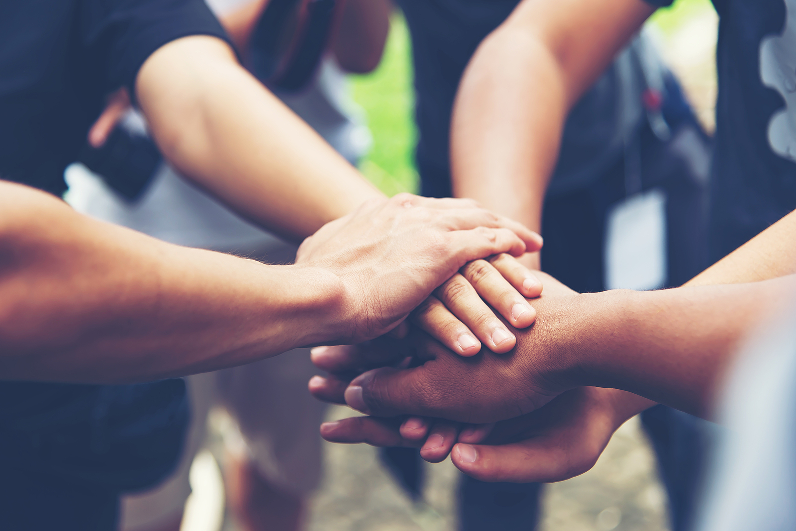 Solidarity unite people hands together community teamwork. Hands of spirit team working together outdoor. Unity strong handshake with people or agreement of feeling or happy diverse education action