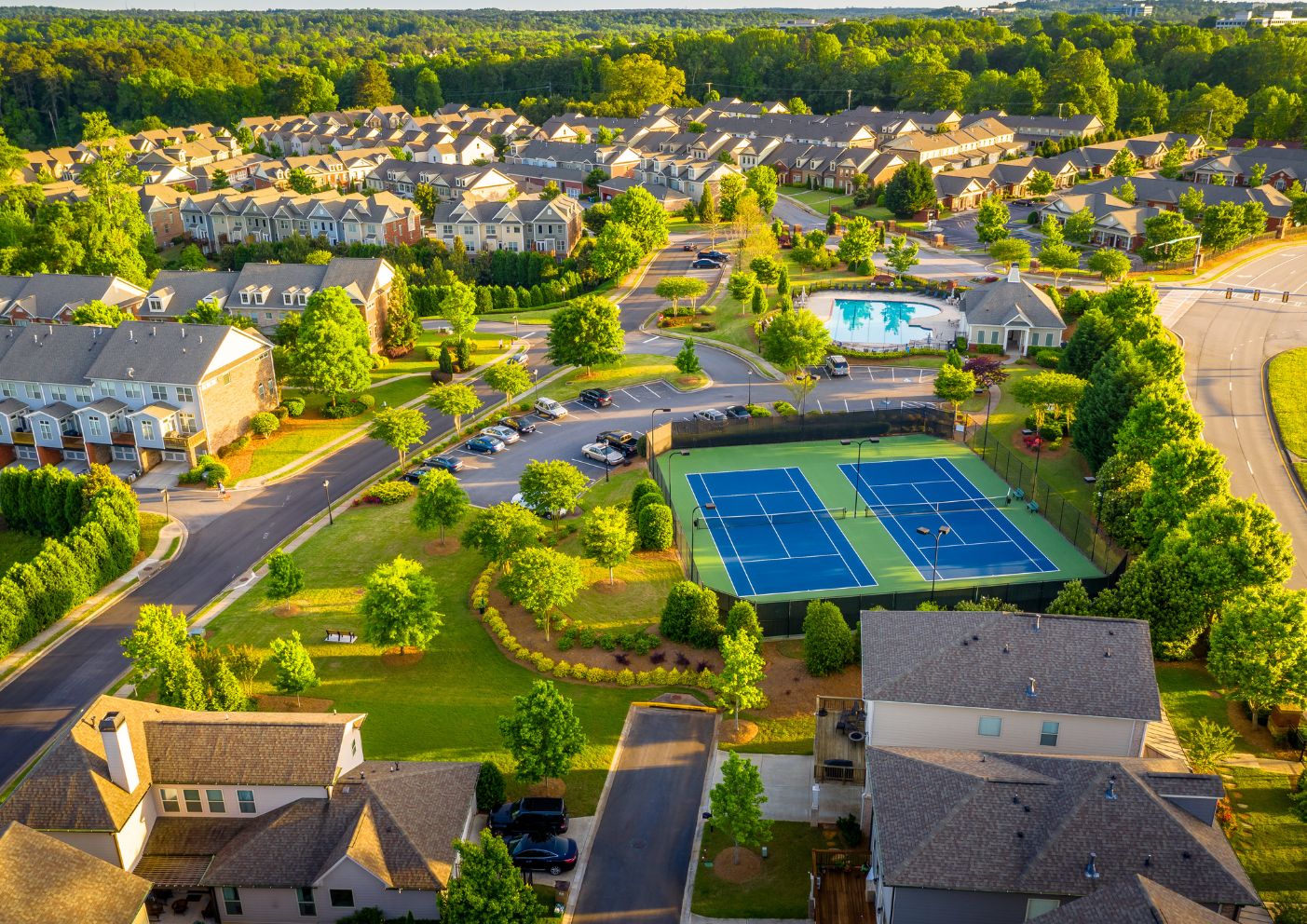 gated community of town houses. Featuring a pool, tennis courts and parks.