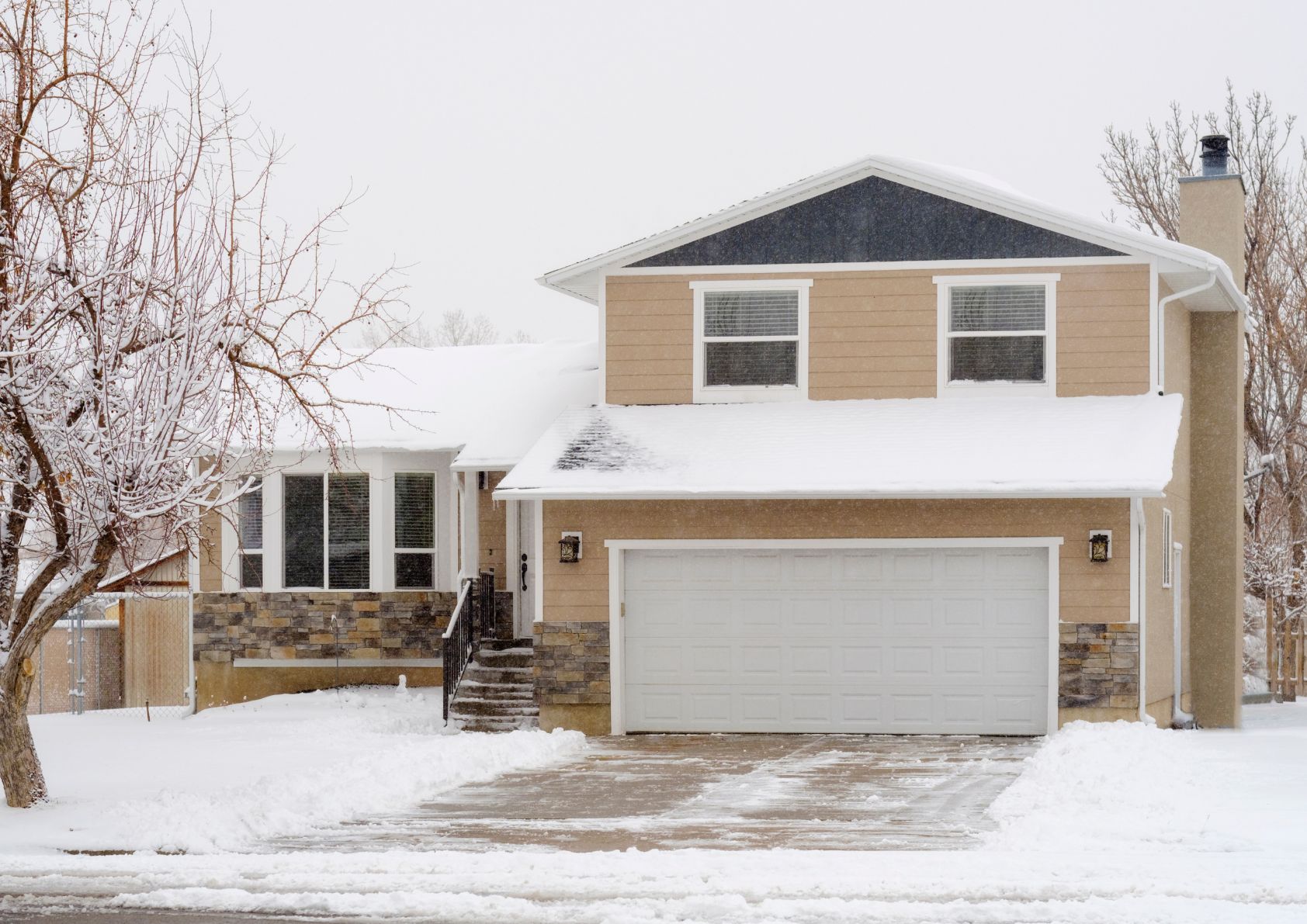 home for sale in the winter with snow. 